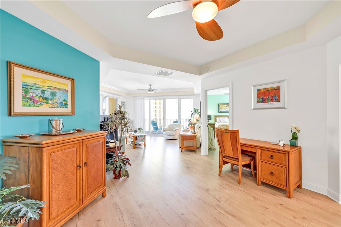 2743 First Street, Unit 1206 Fort Myers, FL 33916 - Photo 18 of 50 a living room with furniture and wooden floor