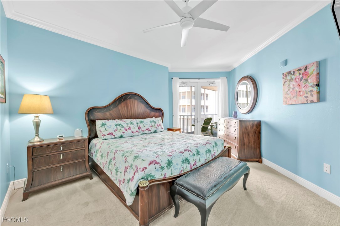 2743 First Street, Unit 1206 Fort Myers, FL 33916 - Photo 20 of 50 a bedroom with a bed mirror on desk and a window