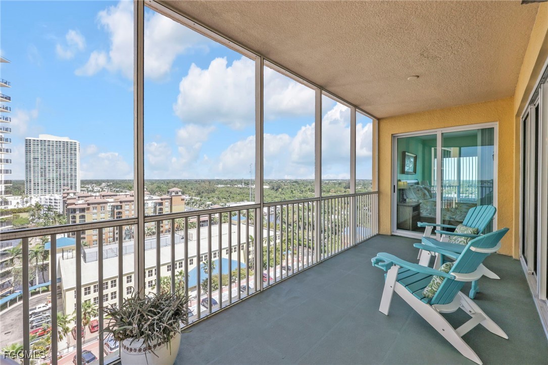2743 First Street, Unit 1206 Fort Myers, FL 33916 - Photo 35 of 50 a view of a porch with furniture and floor to ceiling window