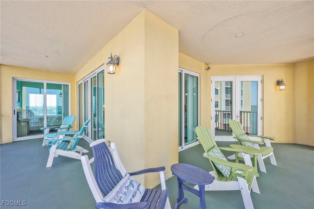 2743 First Street, Unit 1206 Fort Myers, FL 33916 - Photo 36 of 50 a living room with furniture and a potted plant