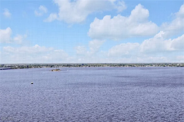 a view of a lake and a yard