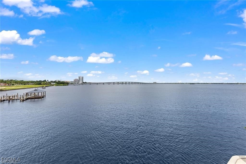2743 First Street, Unit 1206 Fort Myers, FL 33916 - Photo 39 of 50 a view of a lake and a yard