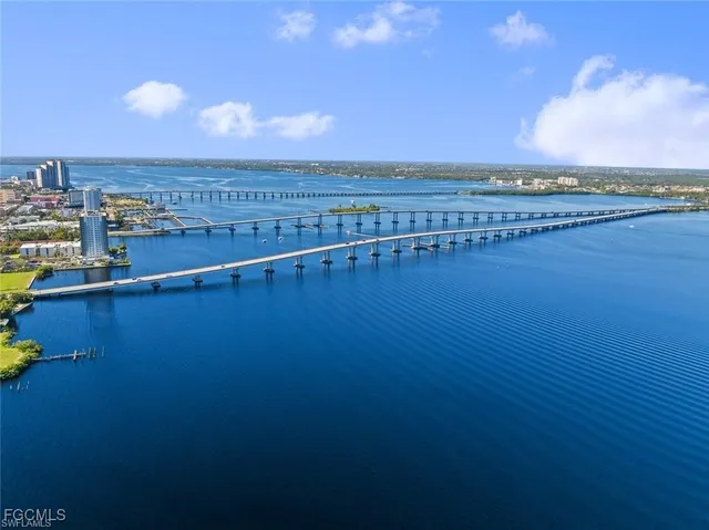 a view of a dining area with furniture and chandelier