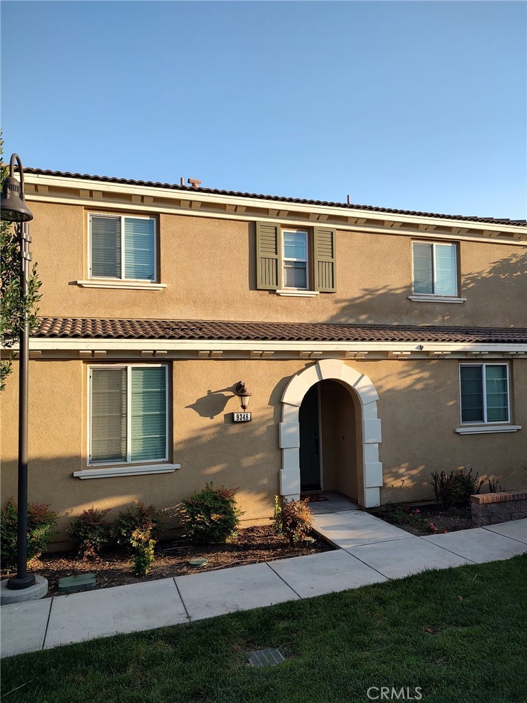 a front view of a house with a yard