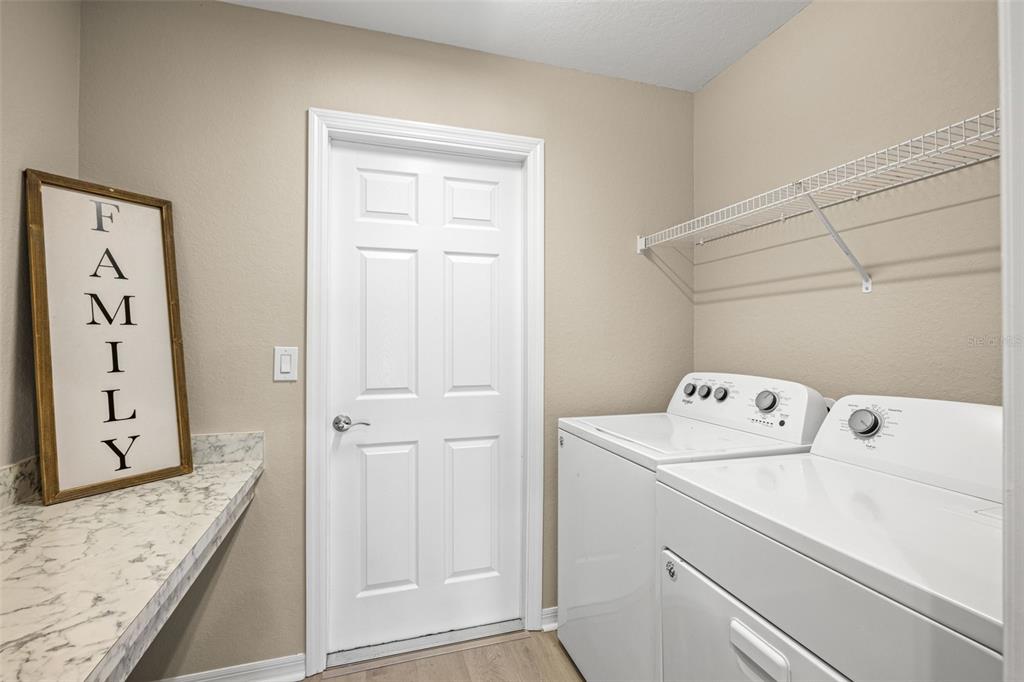 3878 White Ibis Road Lakeland, FL 33811 - Photo 18 of 21 a utility room with dryer and washer