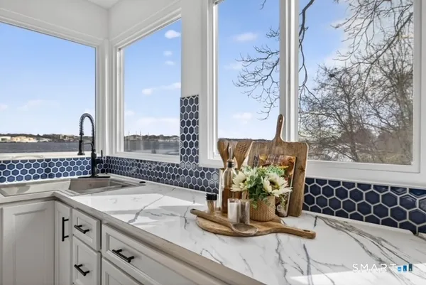 a large kitchen with a stove top oven and refrigerator