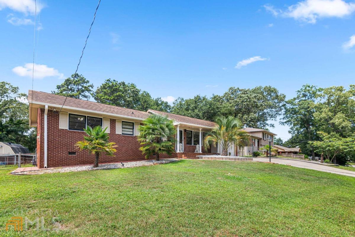 6393 Highview Road Morrow, GA 30260 - Photo 1 of 1 a front view of house with yard and outdoor seating