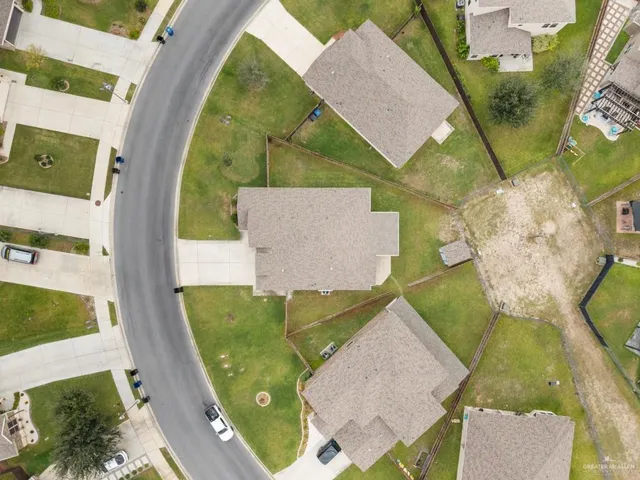 an aerial view of a house with swimming pool