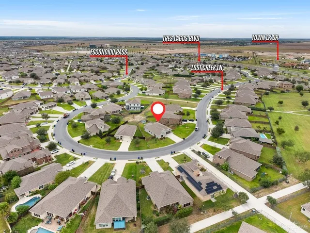 an aerial view of residential houses with outdoor space