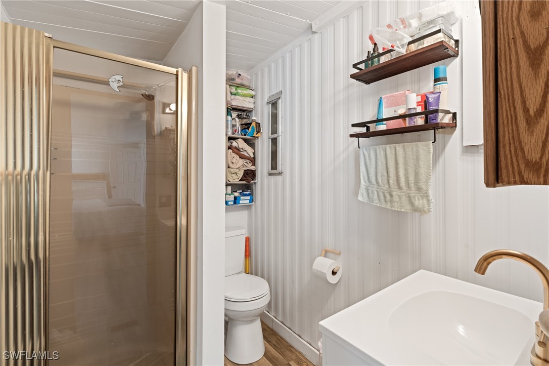 20550 Basin Drive Estero, FL 33928 - Photo 29 of 34 a bathroom with a toilet sink and shower