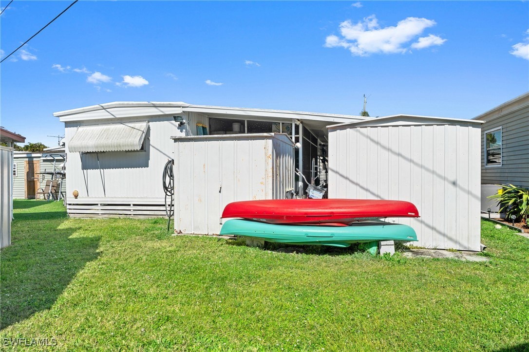 20550 Basin Drive Estero, FL 33928 - Photo 32 of 34 a front view of a house with swimming pool and porch