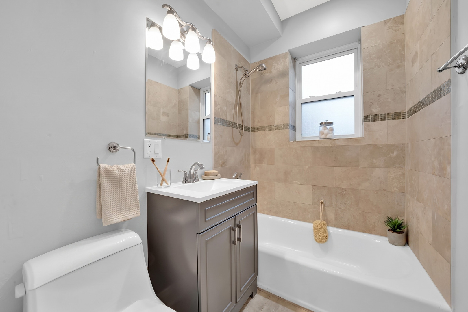 2256 West Arthur Avenue, Unit 2 Chicago, IL 60645 - Photo 18 of 22 a bathroom with a sink and a mirror