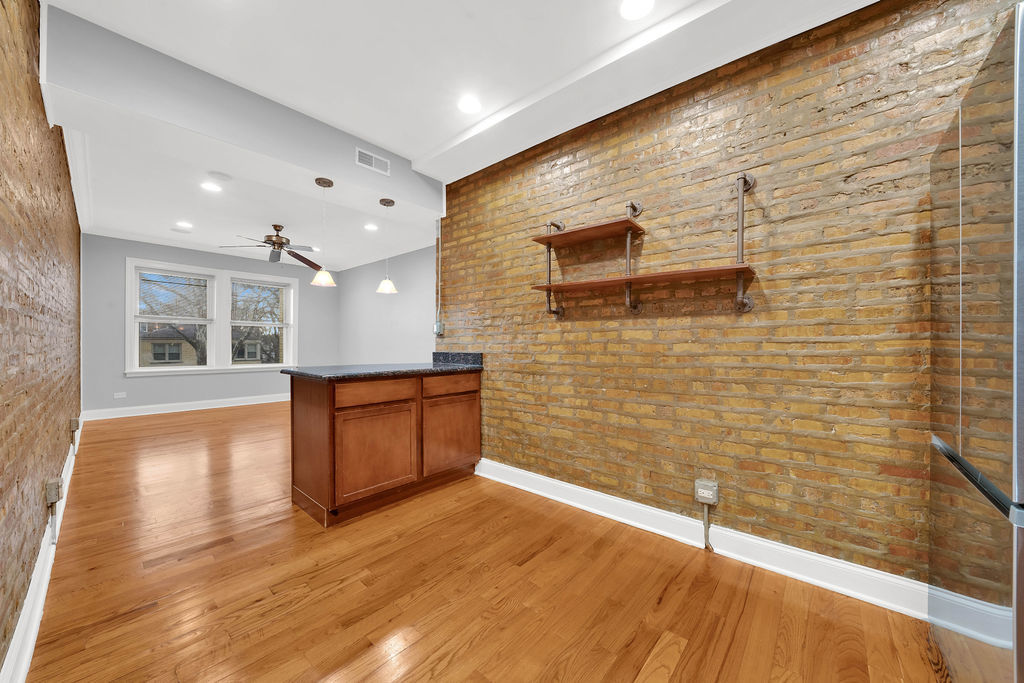 2256 West Arthur Avenue, Unit 2 Chicago, IL 60645 - Photo 6 of 22 a view of an empty room with a window