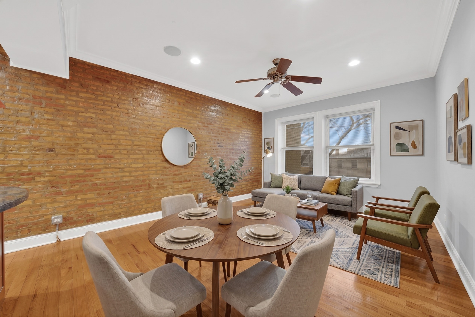 2256 West Arthur Avenue, Unit 2 Chicago, IL 60645 - Photo 7 of 22 a view of a dining room with furniture and wooden floor