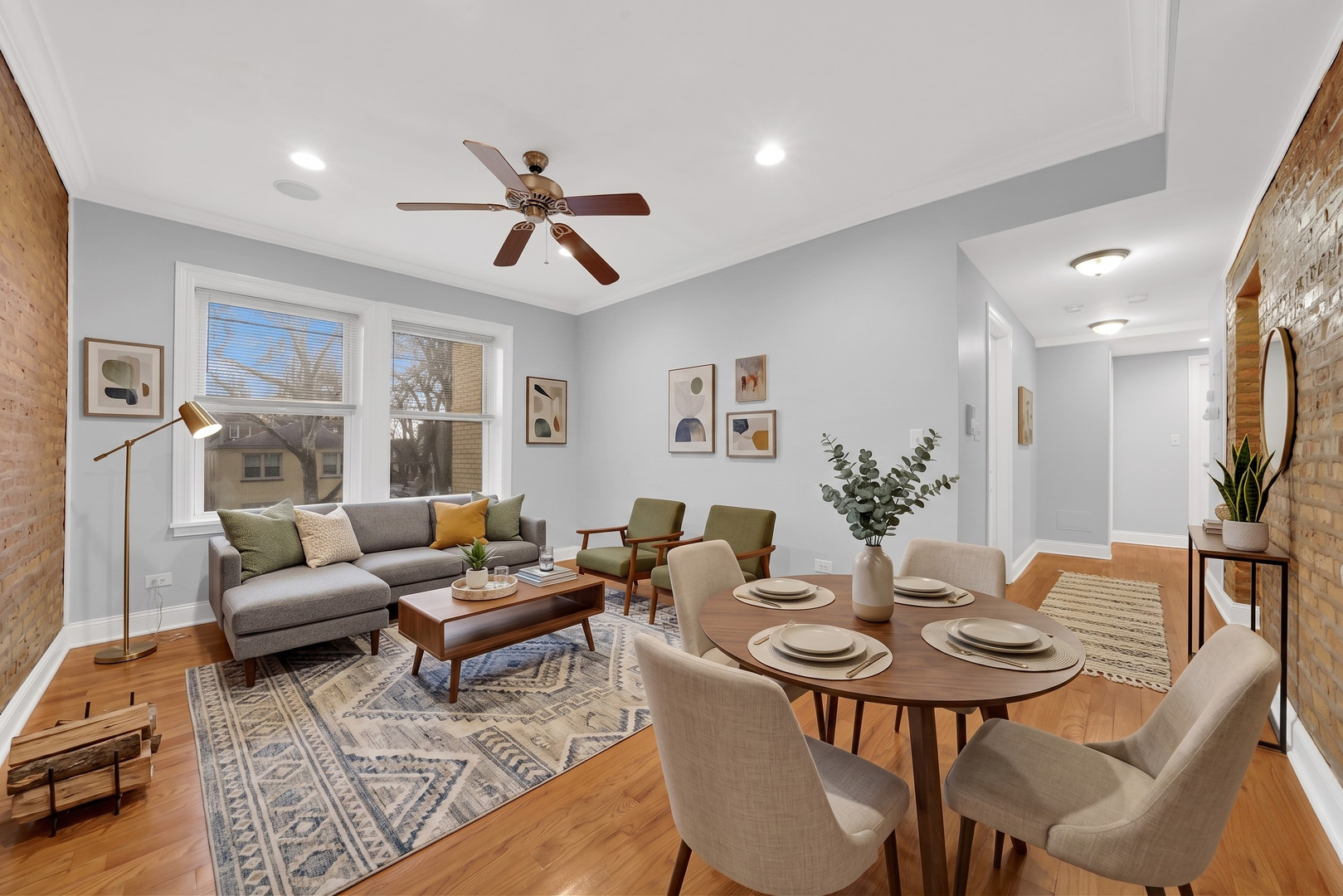 2256 West Arthur Avenue, Unit 2 Chicago, IL 60645 - Photo 9 of 22 a living room with furniture potted plant and a window