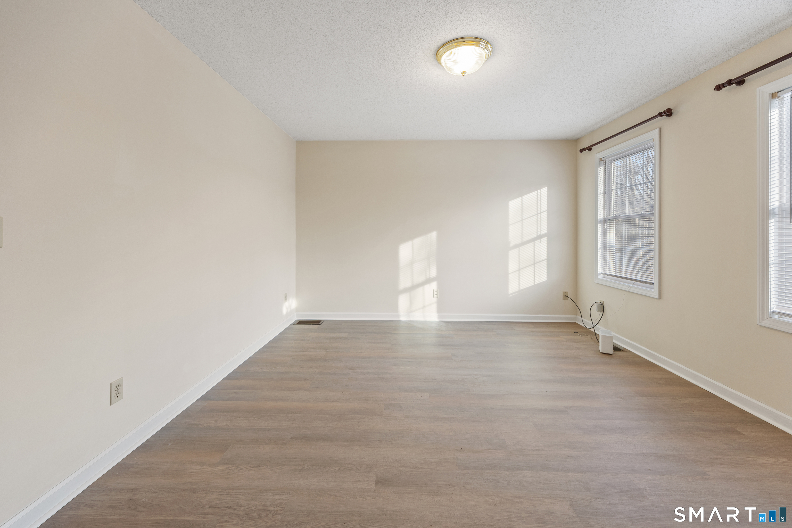 454 Maple Avenue Bristol, CT 06010 - Photo 2 of 27 an empty room with windows and closet