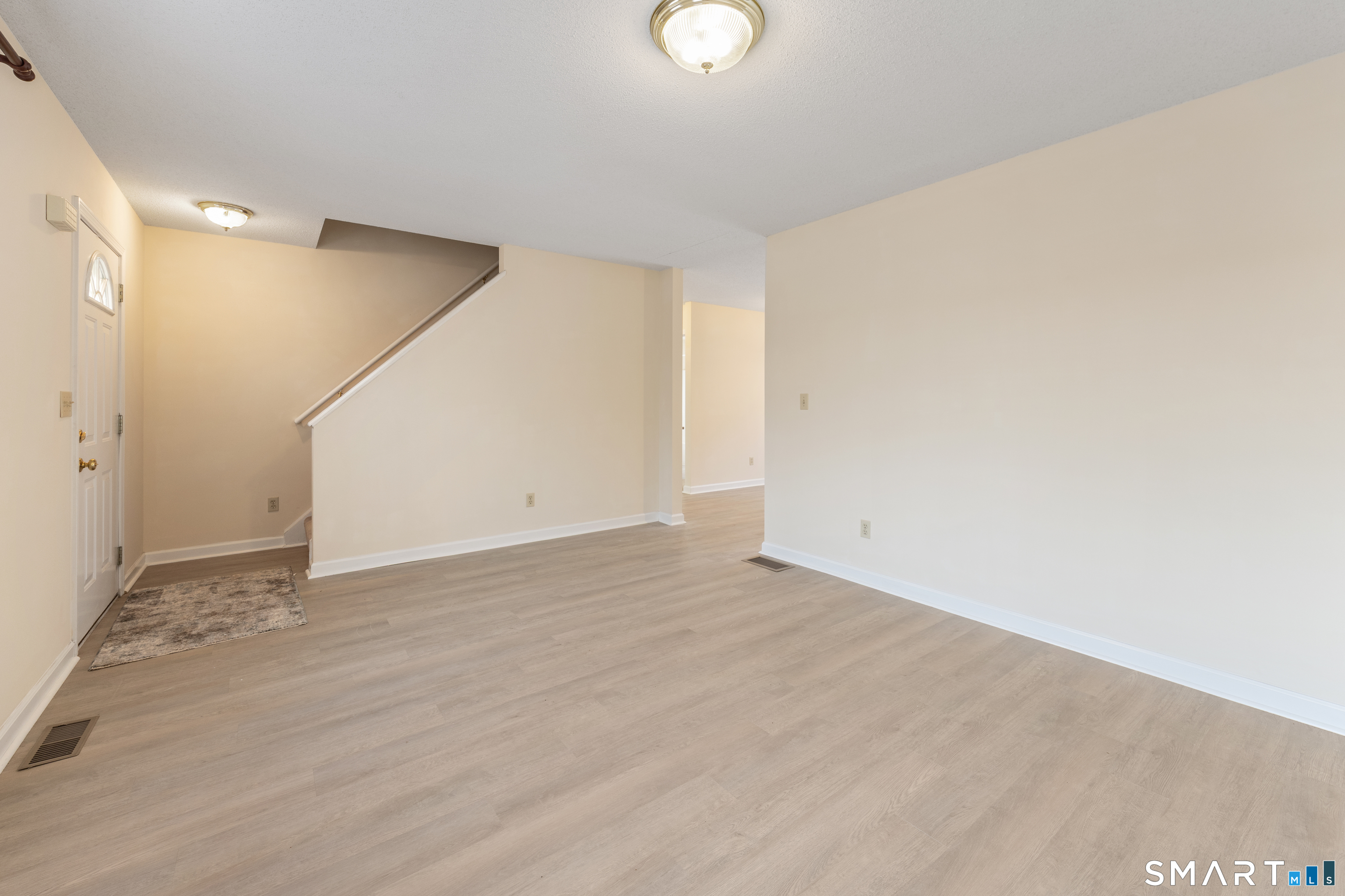 454 Maple Avenue Bristol, CT 06010 - Photo 4 of 27 a view of an empty room with wooden floor