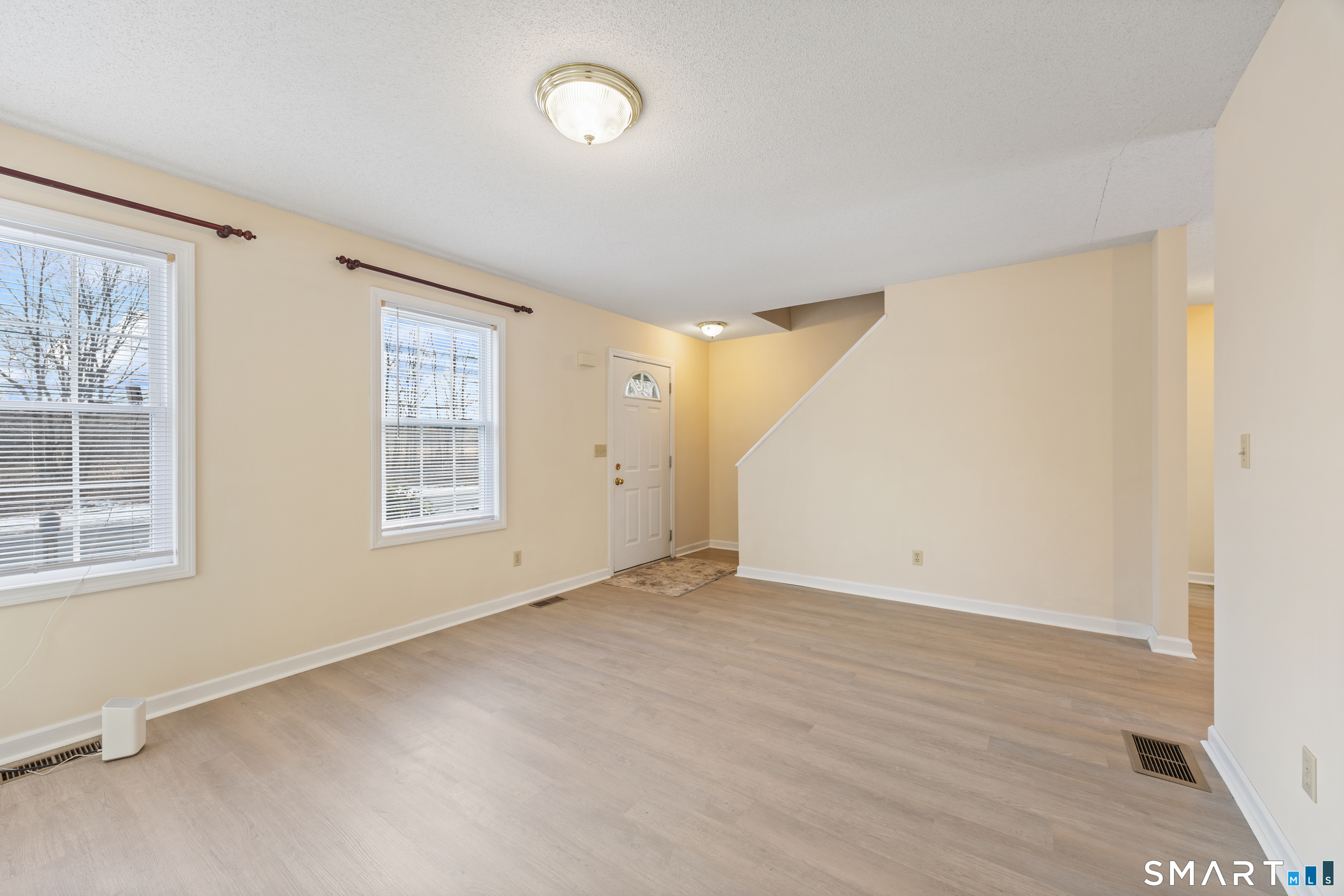 454 Maple Avenue Bristol, CT 06010 - Photo 5 of 27 an empty room with windows