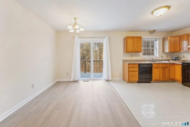 a view of a kitchen with granite countertop cabinets and a sink