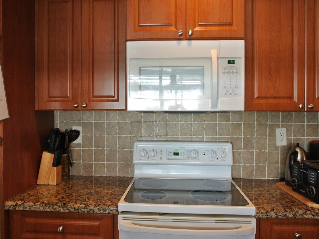 1355 Northwest 4th Street Boca Raton, FL 33486 - Photo 21 of 49 Kitchen Microwave & Stove