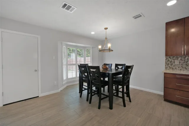 a view of an empty room and wooden floor