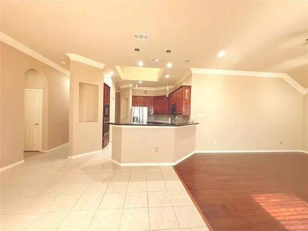 a view of a kitchen with kitchen island