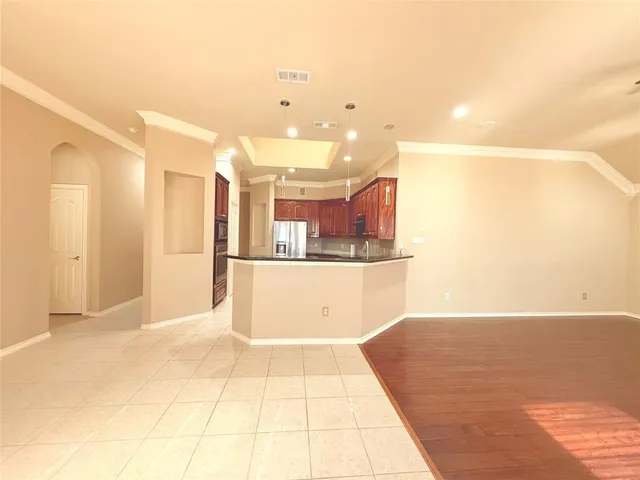 a view of a kitchen with kitchen island