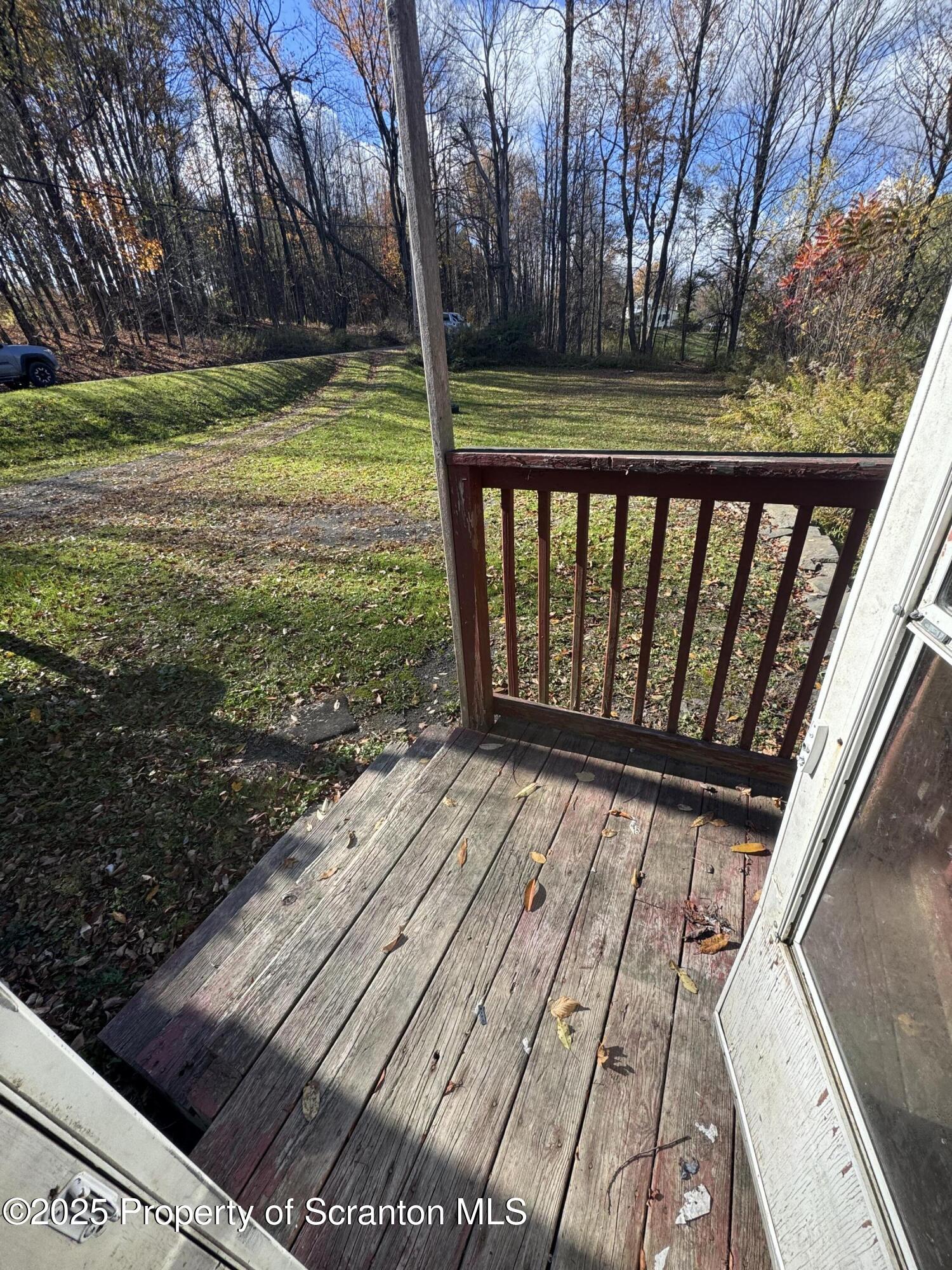1125 Hall Road New Milford, PA 18834 - Photo 11 of 18 a view of backyard with wooden floor and fence