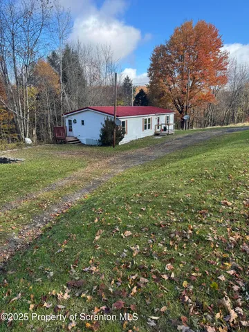 a view of house with outdoor space