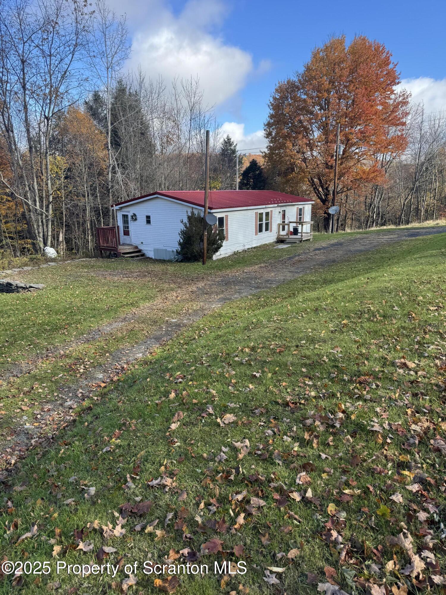 1125 Hall Road New Milford, PA 18834 - Photo 3 of 18 a view of a house with a yard
