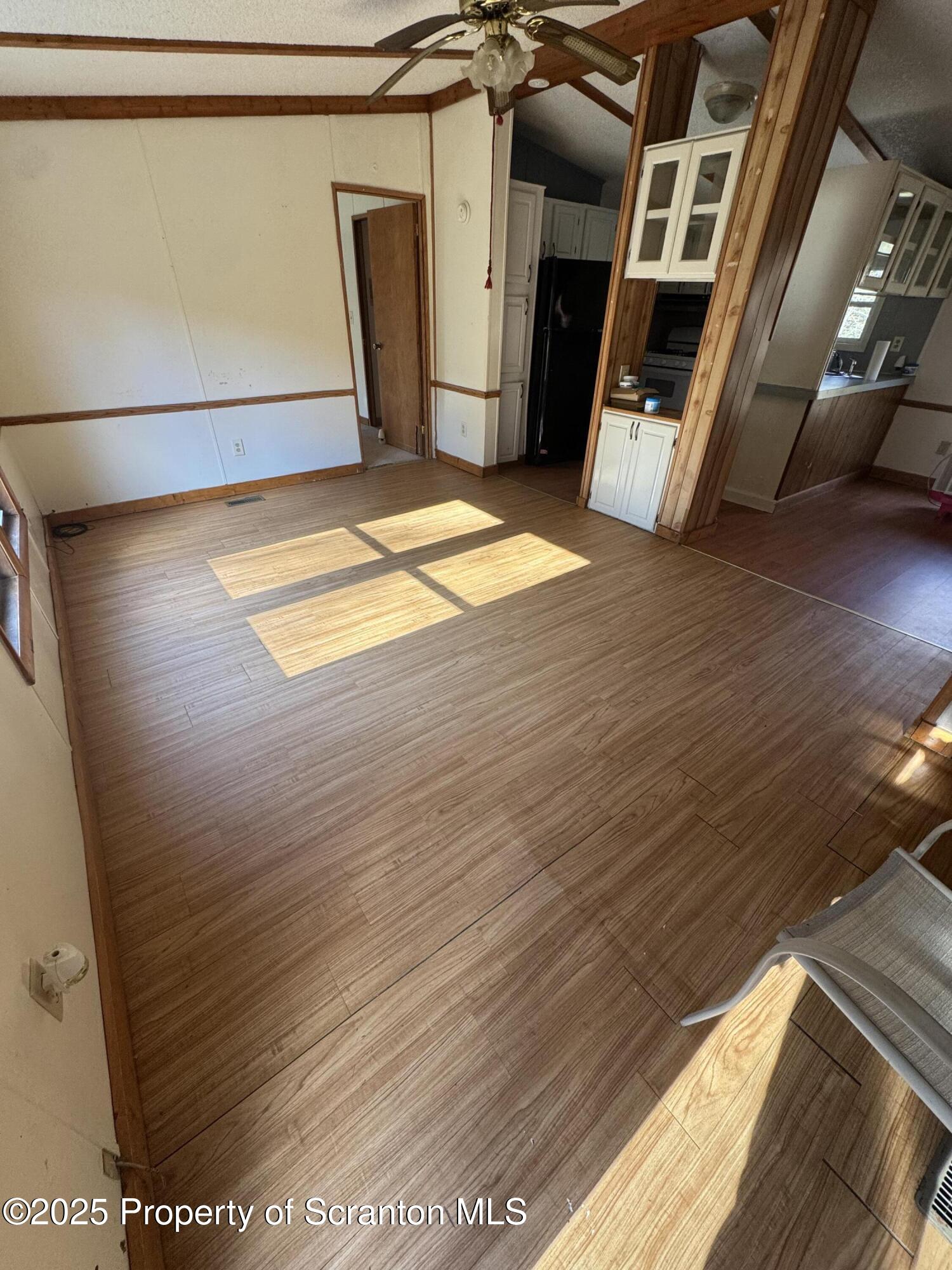 1125 Hall Road New Milford, PA 18834 - Photo 6 of 18 a view of an empty room with wooden floor