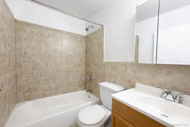 a bathroom with a sink toilet and bathtub