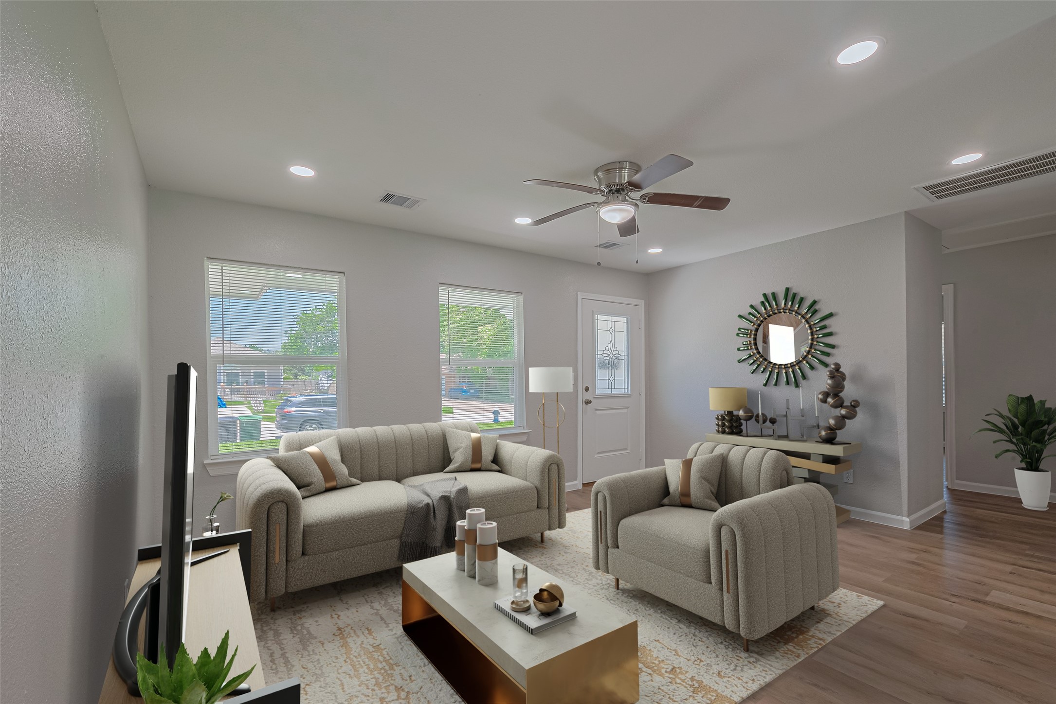 a living room with furniture a chandelier and a window