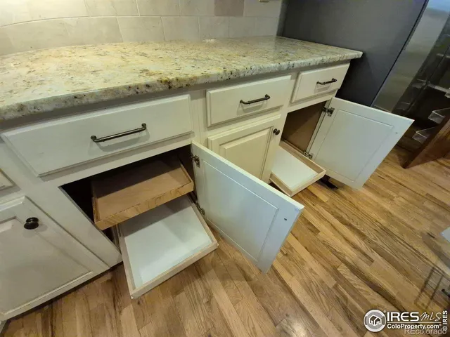 a view of kitchen and wooden floor