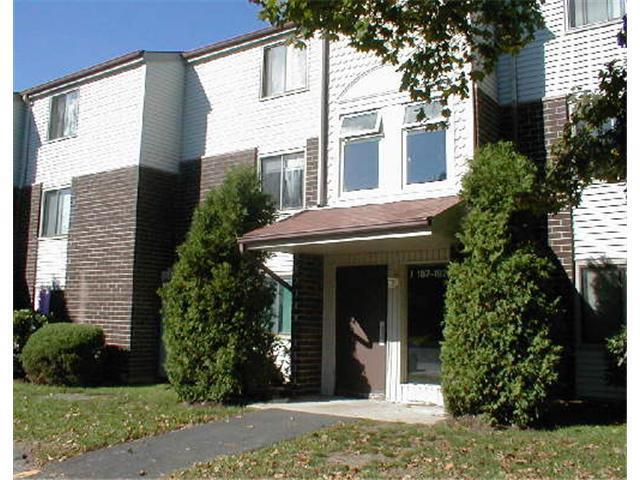 7 Padanaram Road, Unit 189 Danbury, CT 06811 - Photo 1 of 1 a front view of a house with garden