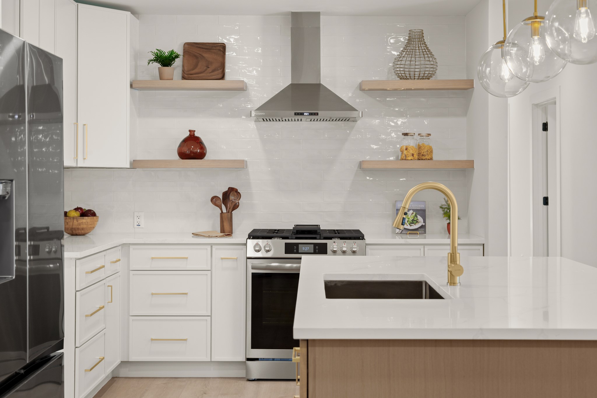 a kitchen with a stove and cabinets