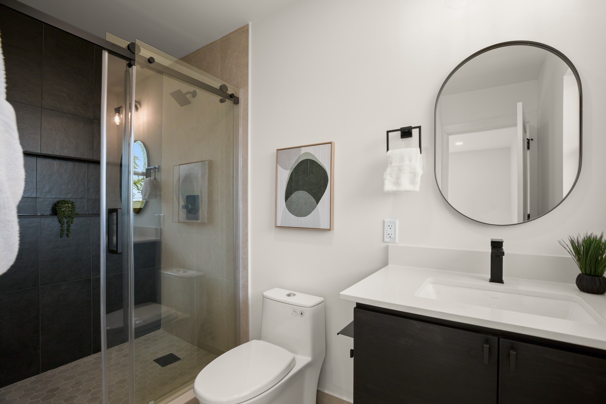 3308 Touchstone Street Austin, TX 78723 - Photo 13 of 38 a bathroom with a toilet a sink and a mirror