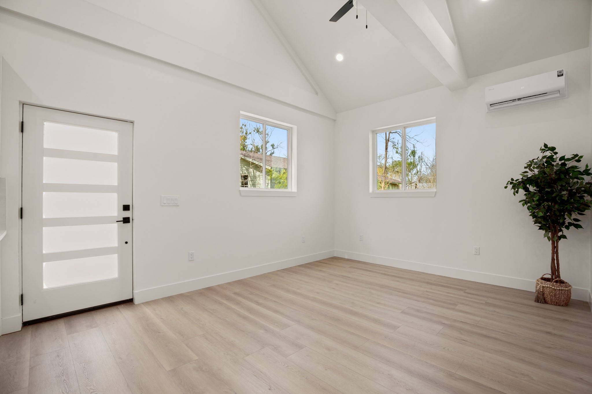 3308 Touchstone Street Austin, TX 78723 - Photo 26 of 38 a view of an empty room with painting on the wall and a potted plant
