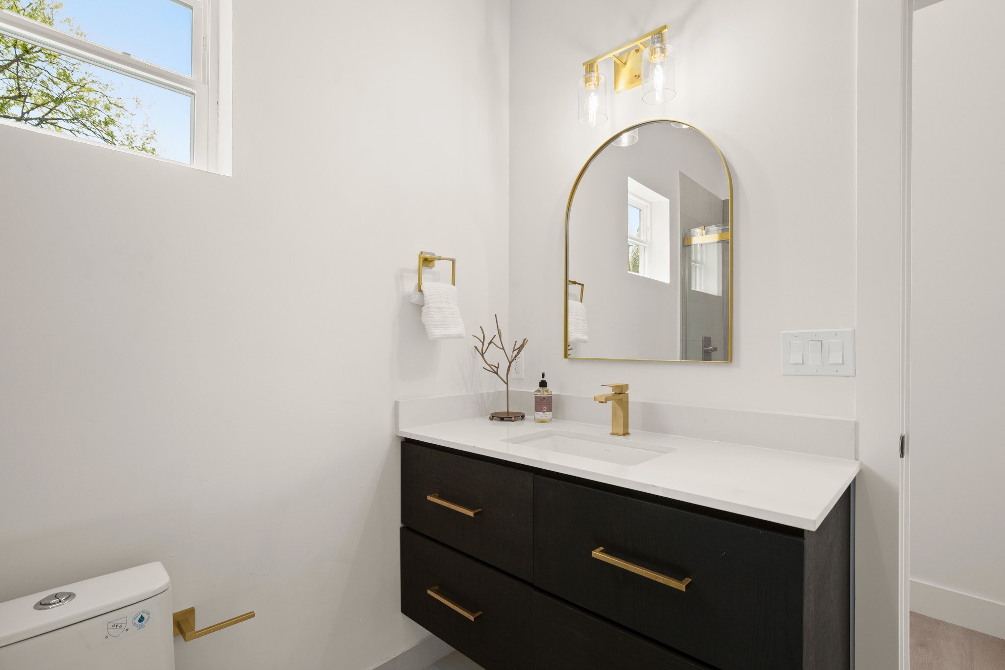 3308 Touchstone Street Austin, TX 78723 - Photo 29 of 38 a bathroom with a sink and a mirror