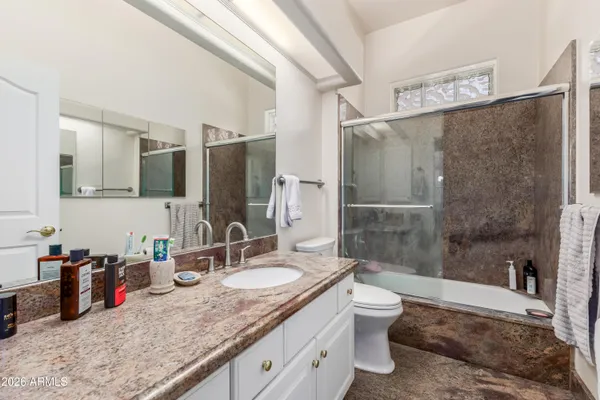 a room with gym equipment and windows