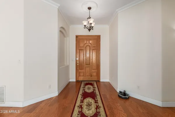 a view of an entryway with wooden floor