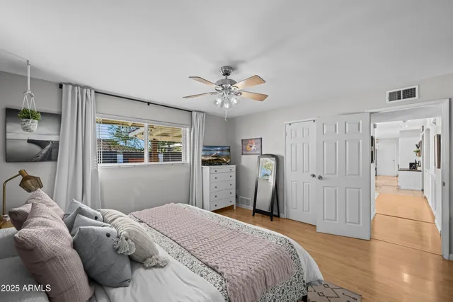 a bedroom with a bed and a window