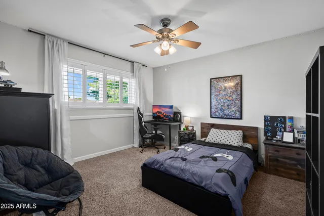 a bedroom with a bed furniture and a window