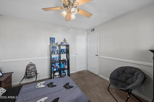 a room with a workspace and a couch