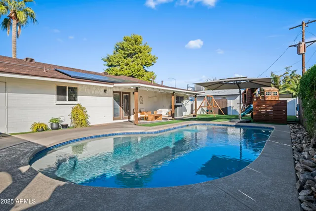 front view of house with a swimming pool