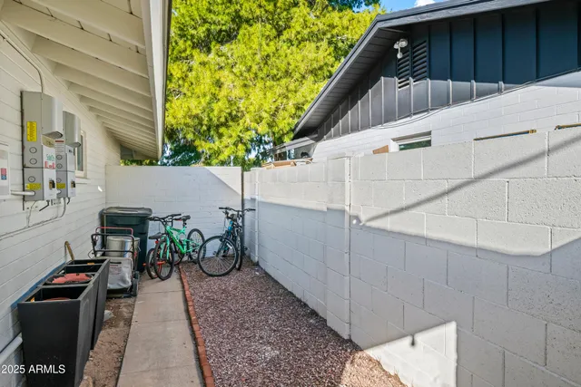 a house view with a backyard and a garden