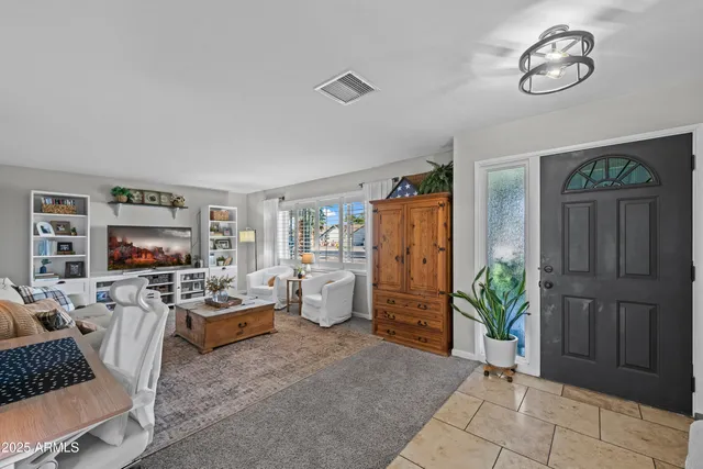 a view of a livingroom with furniture and window