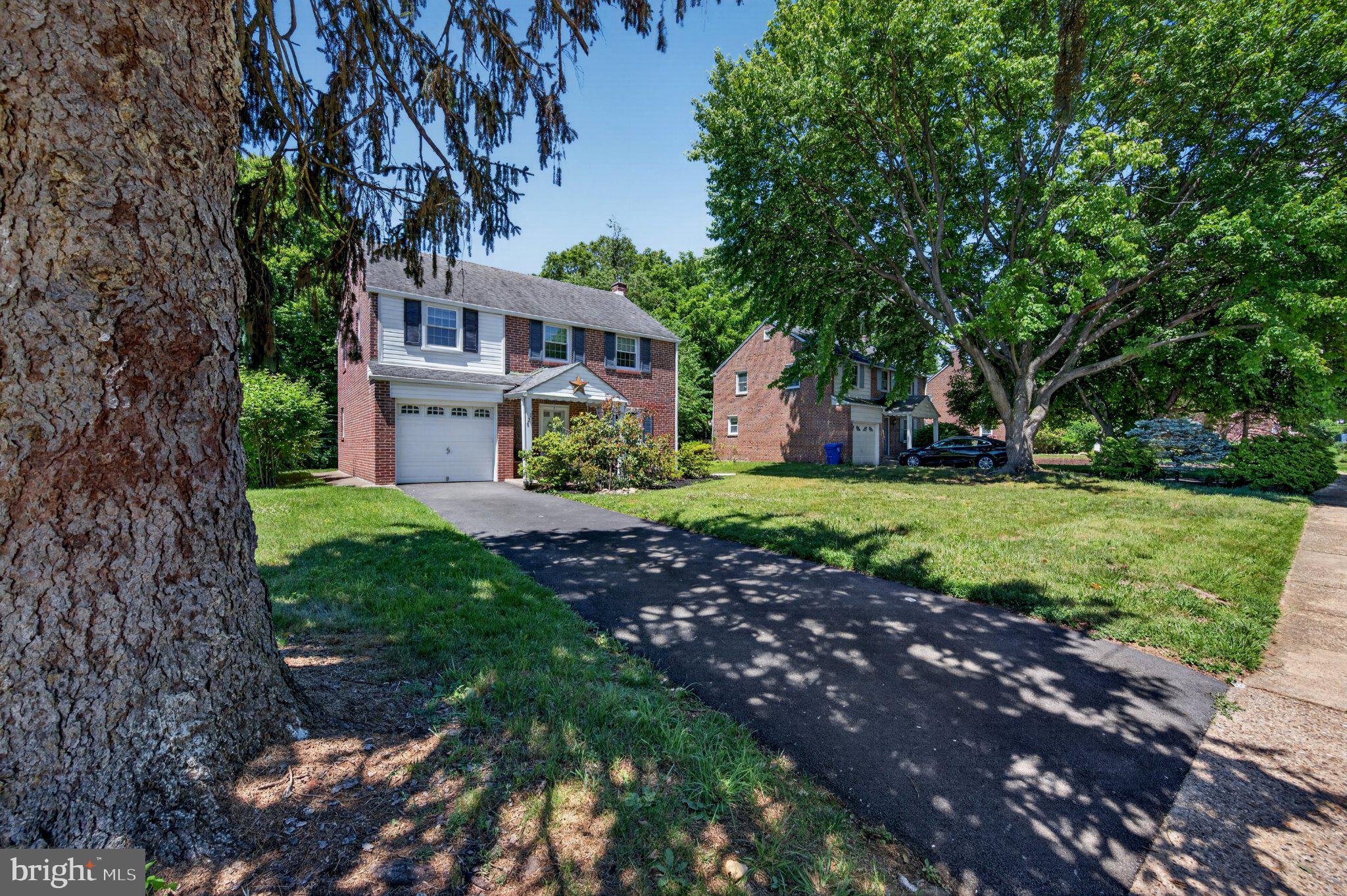 128 Boncouer Road Cheltenham, PA 19012 - Photo 3 of 31 Charming home with lush greenery.
