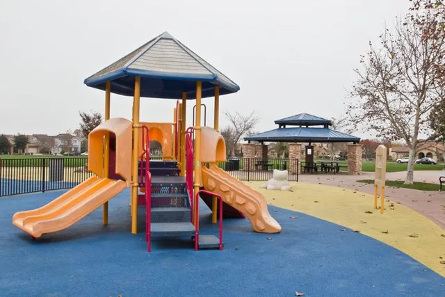 a view of a field of grass and trees