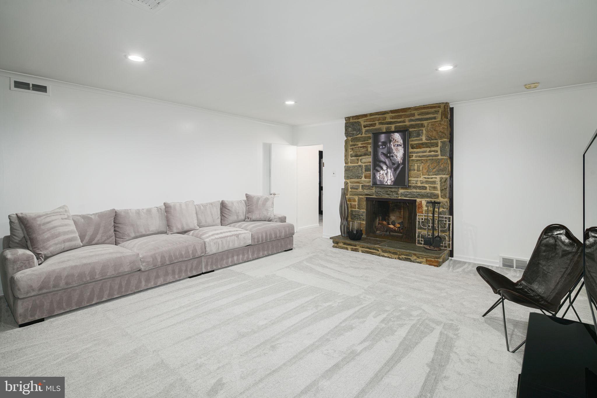 7908 Rolling Green Road Cheltenham, PA 19012 - Photo 19 of 35 Lower Level with Fireplace & Built-Ins